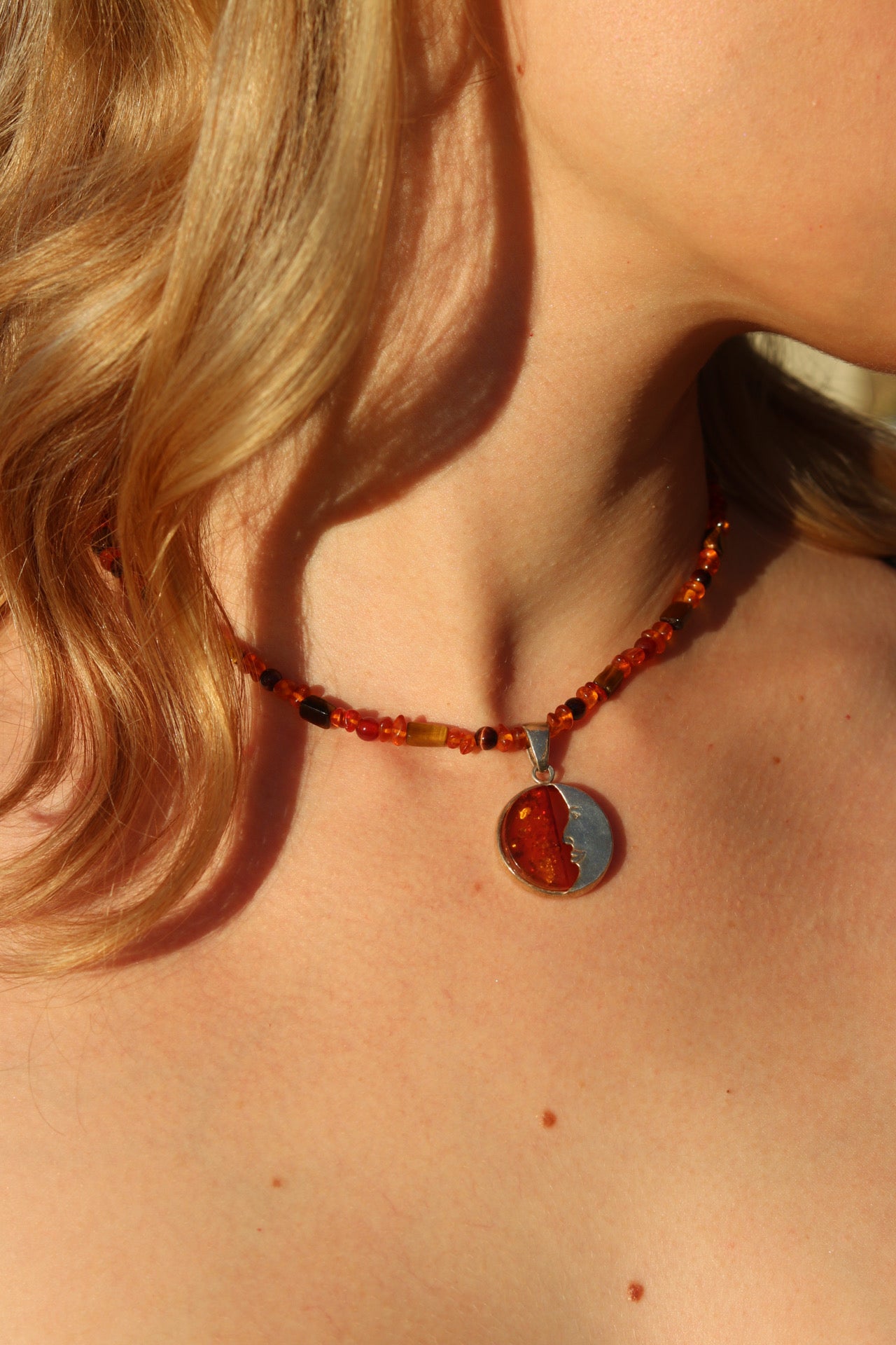 Amber crescent moon pendant